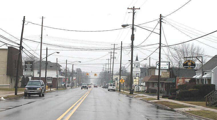 A street-view photograph of Bedford Township in Michigan taken on a rainy day. Bedford, Michigan is a location served by AAA Standard Services.